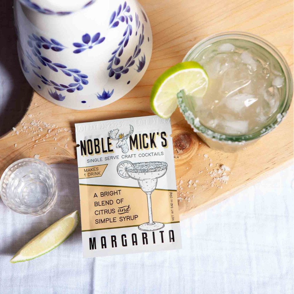 Margarita mixed in glass with tequila and lime