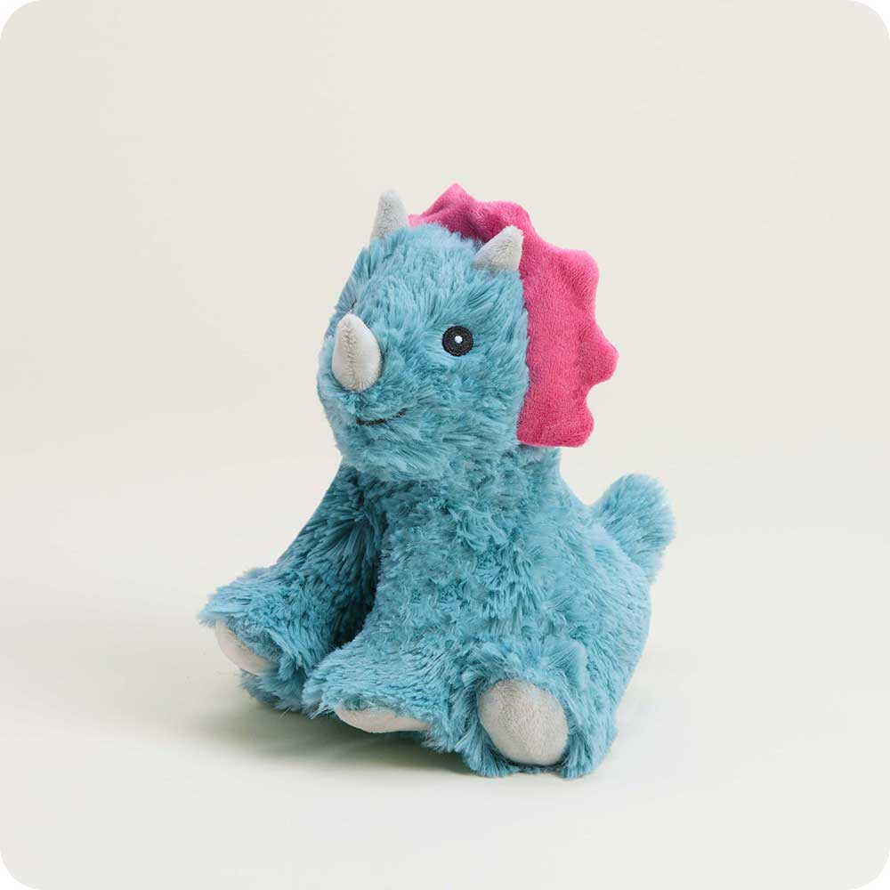 Triceratops Warmies Junior held by child