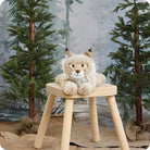 Bob Cat plush held in arms