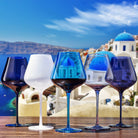 Santorini colored wine glasses styled on dinner table